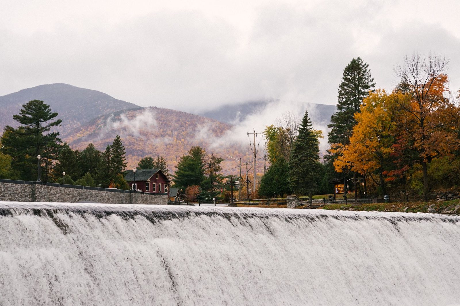 A river cascade under autumn trees